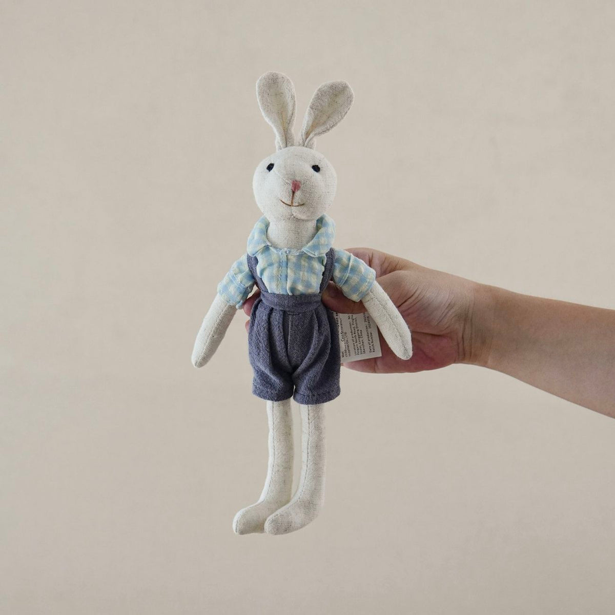 Bunny Doll with Long Legs, Fabric Rabbit in a Pinafore, 22 cm, Ages 0, 3, close-up detail