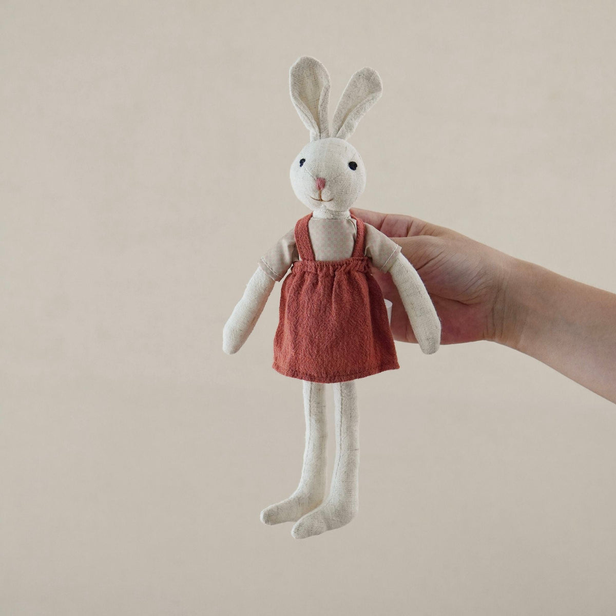 Bunny Doll with Long Legs, Fabric Rabbit in a Pinafore, 22 cm, Ages 0, 3, styled in a nursery setting