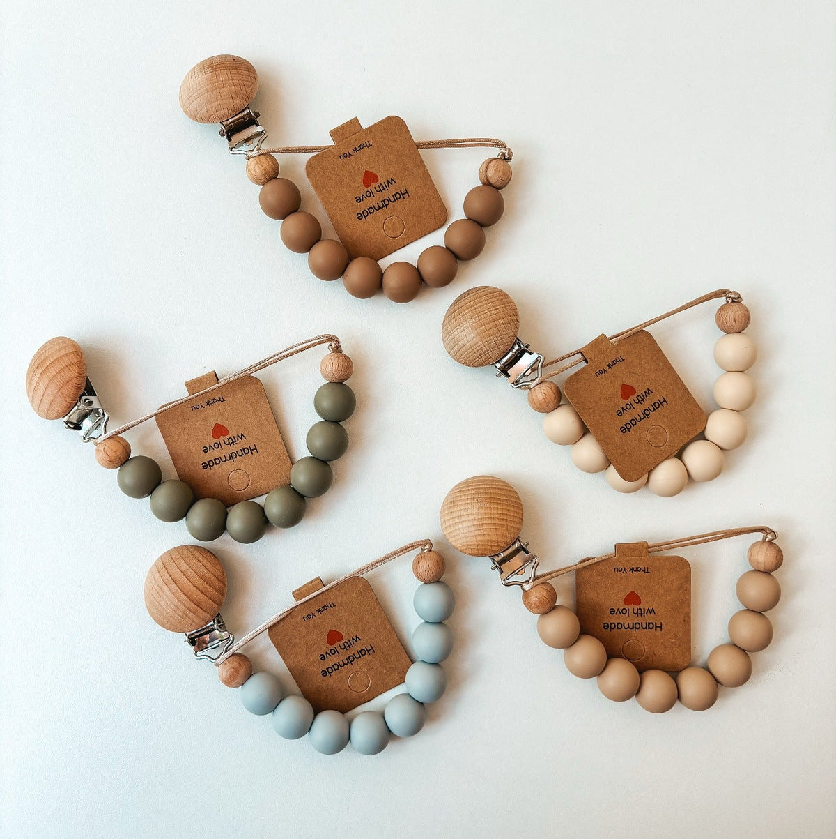 Silicone and Beech Dummy Clip, Beaded Soother Chain, styled with props