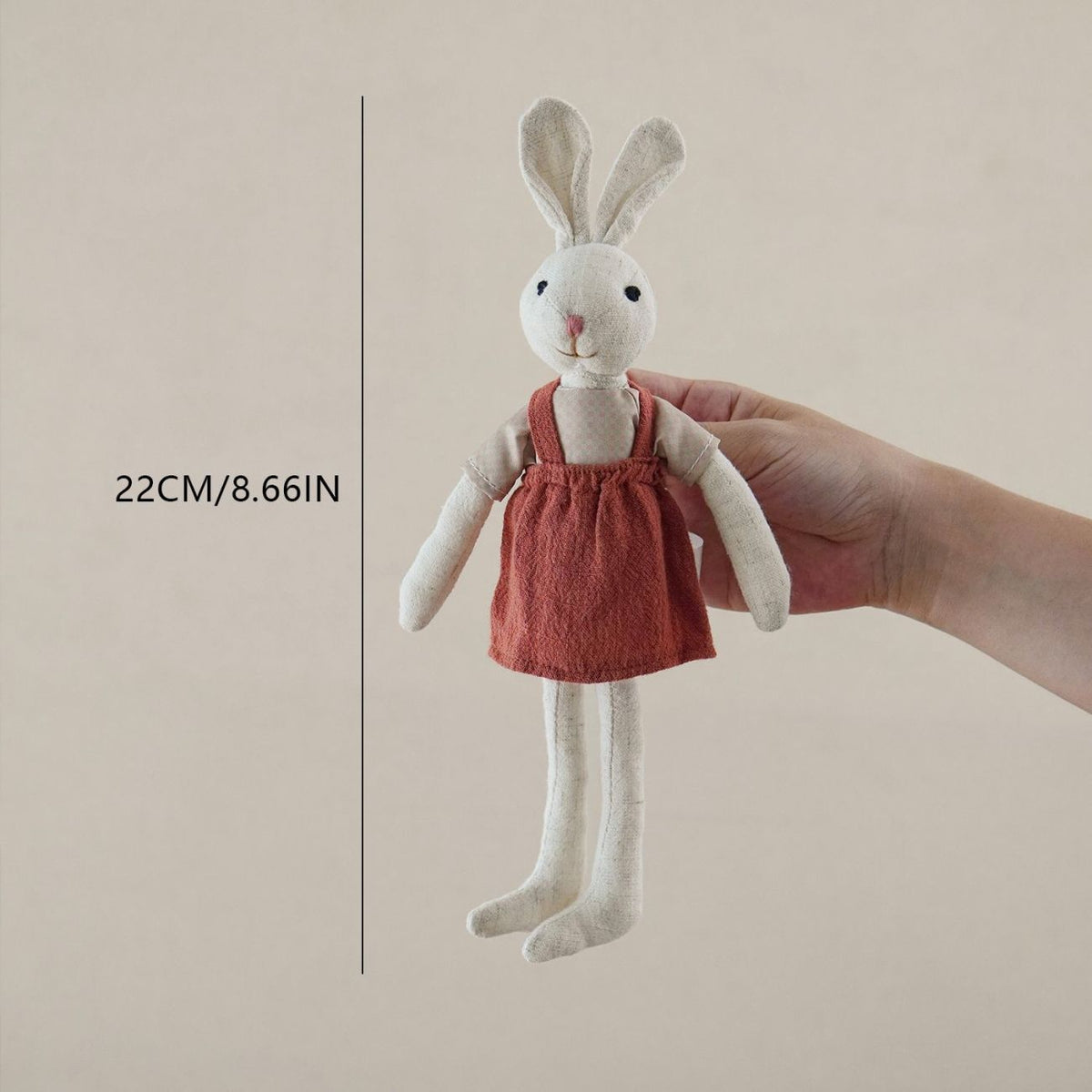 Bunny Doll with Long Legs, Fabric Rabbit in a Pinafore, 22 cm, Ages 0, 3, held in hand for scale