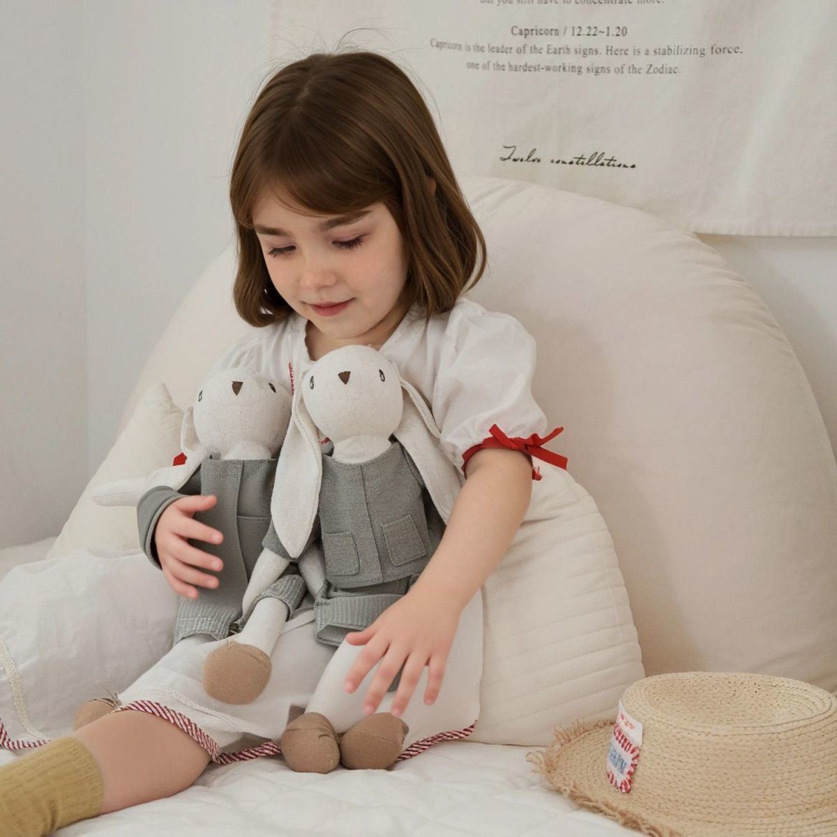 Bunny Doll with Long Legs, Fabric Rabbit in a Pinafore, 22 cm, Ages 0, 3, close-up of the fabric texture