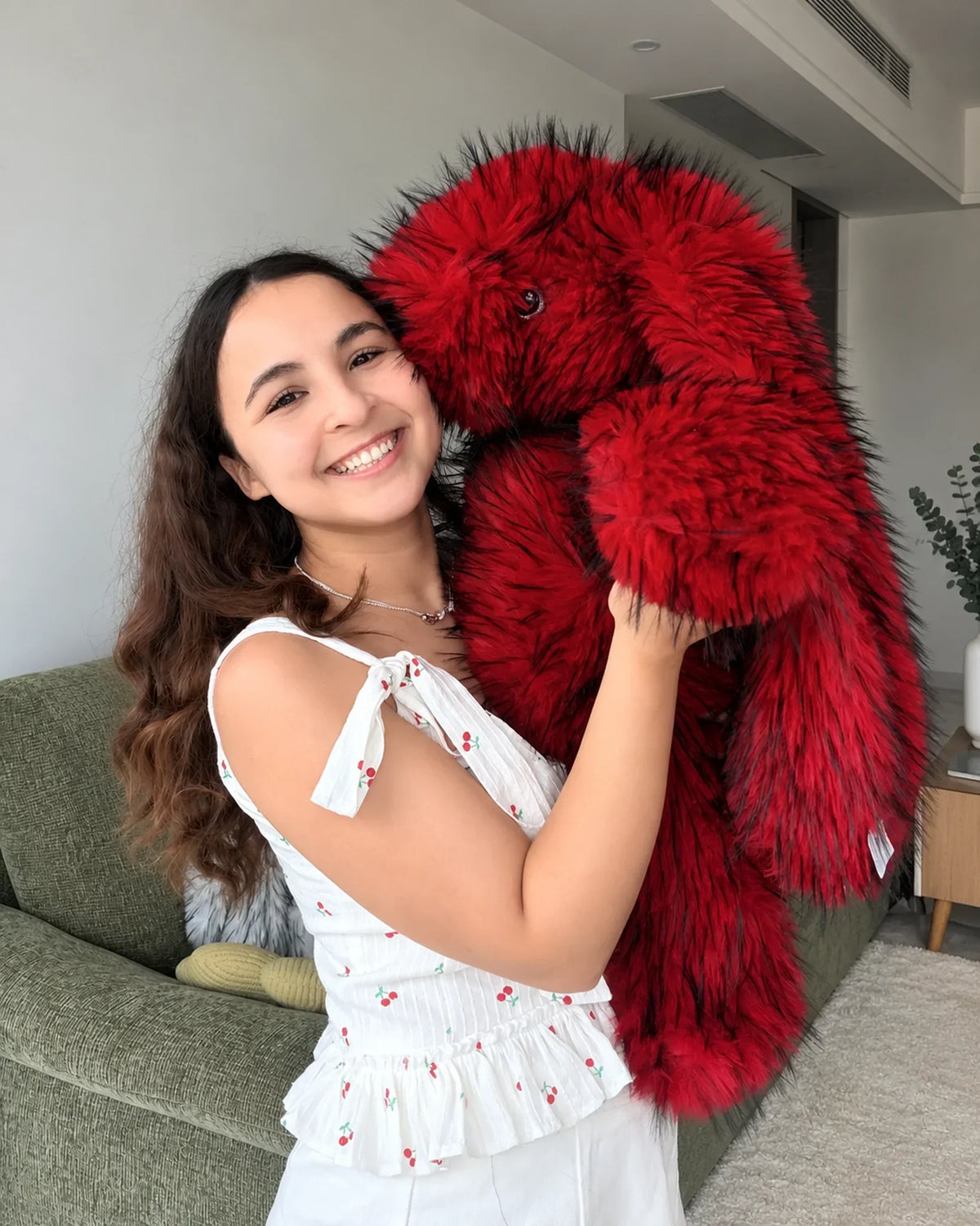 Cherry Red giant bunny plush toy 70cm, hugged over the shoulder