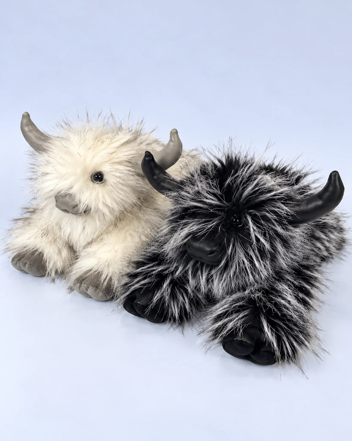 Frost White and Smoky Black Highland cow plush toys together